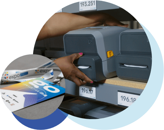 Expo Pass badge printers organized on warehouse shelves with branded lanyards