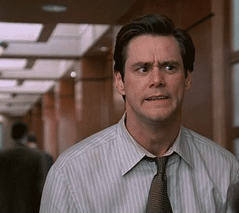 GIF of Jim Carrey gasping and running his hands over his face