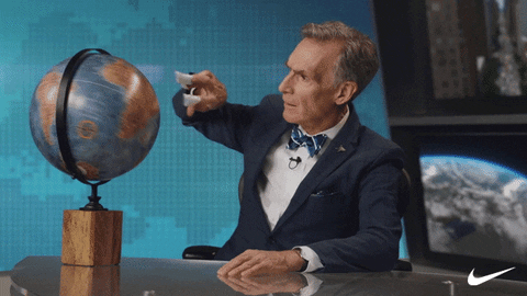 GIF of Bill Nye talking while rotating a globe with two fingers