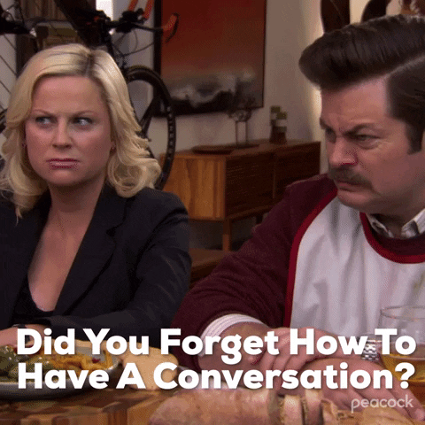 GIF of a man saying to woman "Did you forget how to have a conversation?" at the dinner table. 